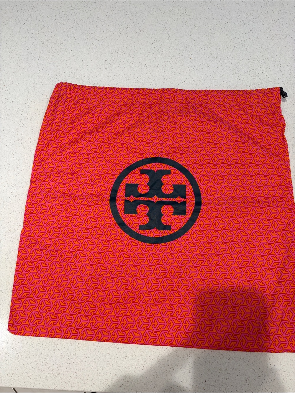 Tory Burch Pink and Orange Logo Printed dust cover bag.